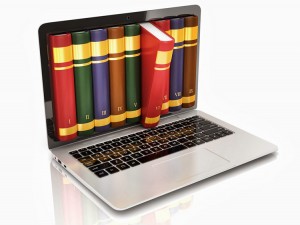 Books popping out of a laptop screen